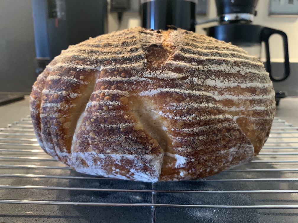 A tall loaf of sourdough bread