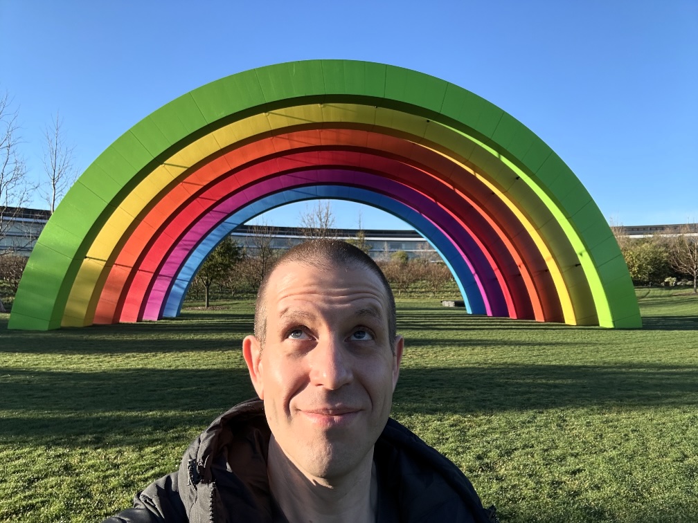 A photo of me in front of the Apple Park rainbow stage