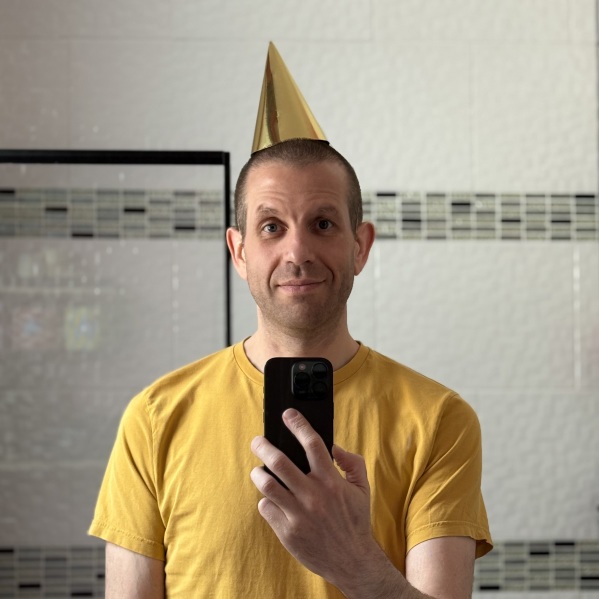 Me accidentally wearing a party hat that’s the same colour as my T-shirt