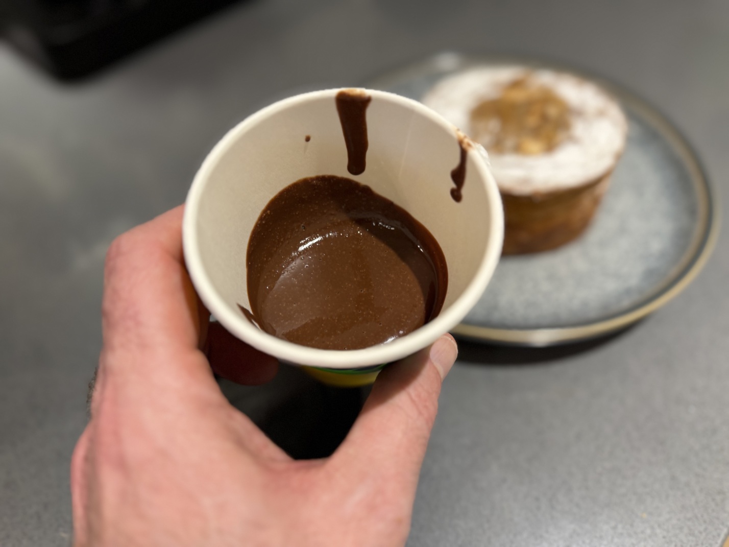 A paper cup of Okja’s chocolate hazelnut spread