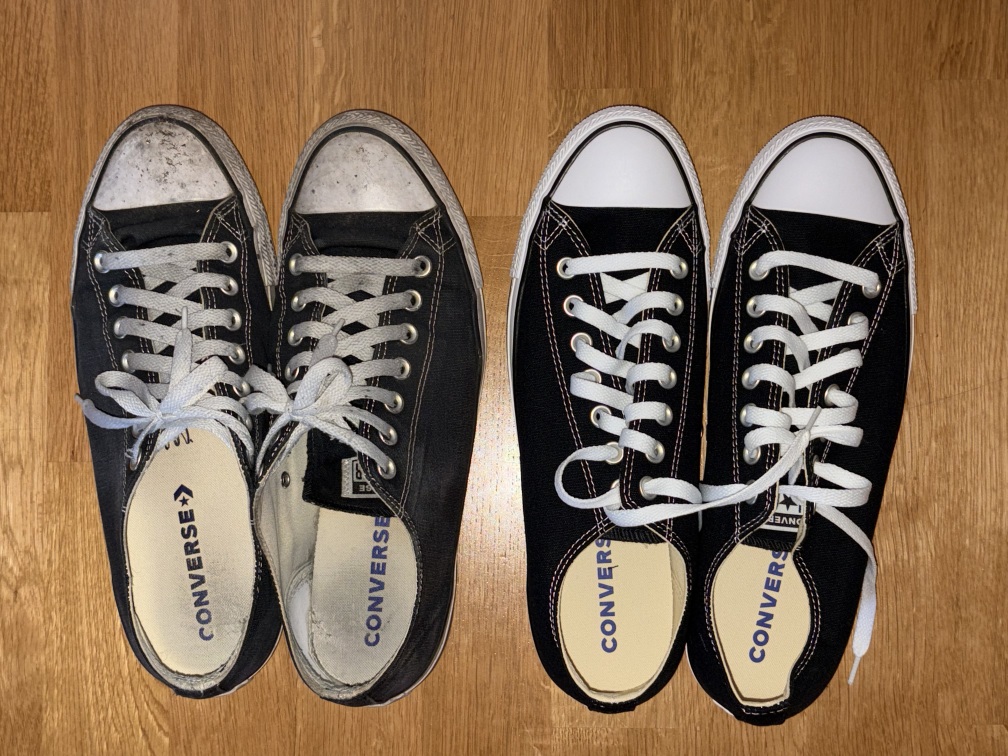 A pair of dirty old Converse trainers next to a pair of brand new ones