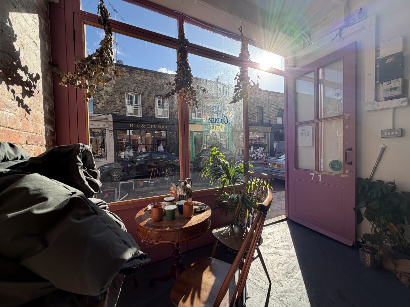 A view out of Corner Deli onto a sunny Columbia Road