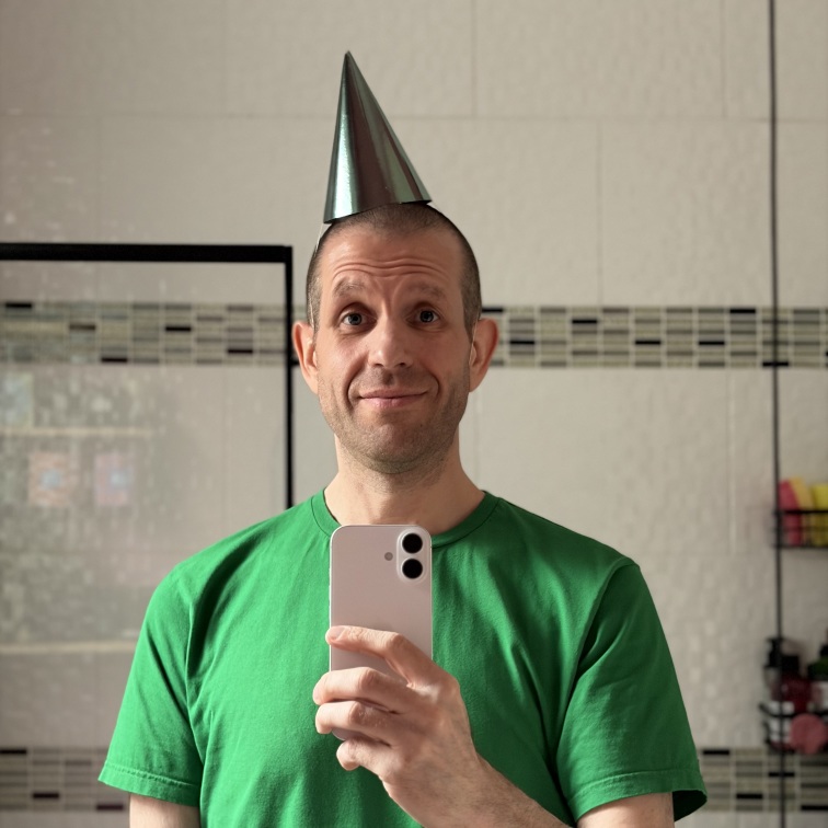 Me accidentally wearing a party hat that’s the same colour as my T-shirt