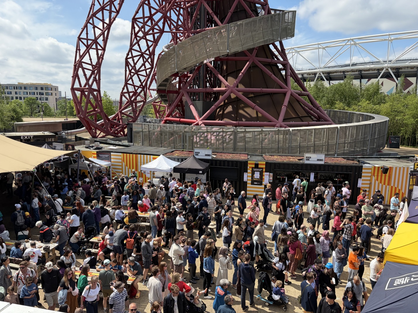 A view of the market in front of the base of the ArcelorMittal Orbit